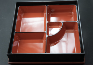 Bento box with compartments, red interior